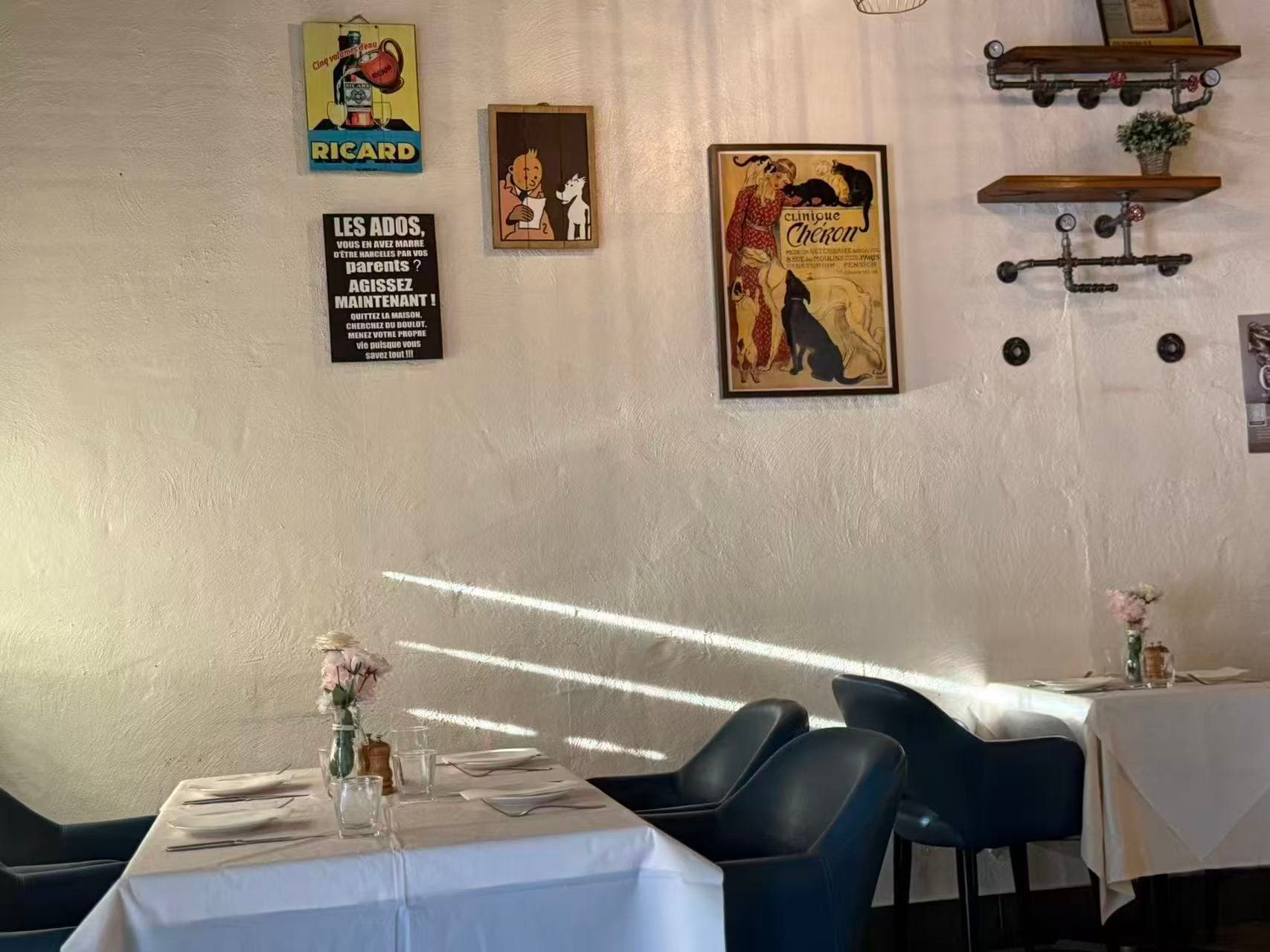 Bistro dining room — Parisian posters and white linen